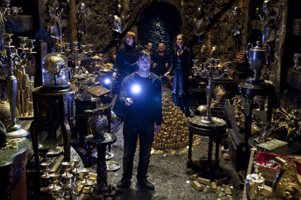 DANIEL RADCLIFFE (foreground) as Harry Potter and (background l-r) RUPERT GRINT as Ron Weasley, WARWICK DAVIS as Griphook, JON KEY as Bogrod and EMMA WATSON as Hermione Granger and in Warner Bros. Pictures fantasy adventure HARRY POTTER AND THE DEATHLY HALLOWS  PART 2, a Warner Bros. Pictures release.