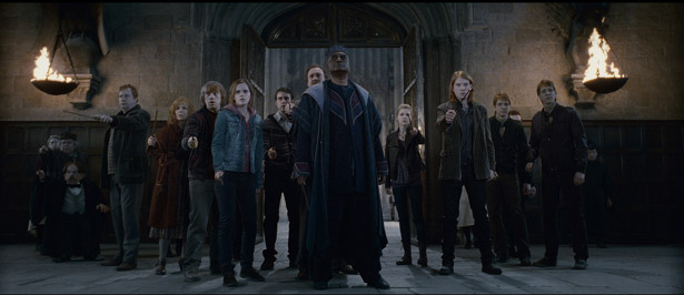 (L-r) GEMMA JONES as MADAM POMFREY, MIRIAM MARGOLYES as Professor Pomona Sprout, WARWICK DAVIS as Professor Flitwick, MARK WILLIAMS as Arthur Weasley, JULIE WALTERS as Molly Weasley, RUPERT GRINT as Ron Weasley, EMMA WATSON as Hermione Granger, MATTHEW LEWIS as Neville Longbottom, DAVID THEWLIS as Remus Lupin, GEORGE HARRIS as Kingsley Shacklebolt, CLÉMENCE POÉSY as Fleur Delacour, DOMHNALL GLEESON as Bill Weasley, JAMES PHELPS as Fred Weasley and OLIVER PHELPS as George Weasley in Warner Bros. Pictures fantasy adventure HARRY POTTER AND THE DEATHLY HALLOWS  PART 2, a Warner Bros. Pictures release.